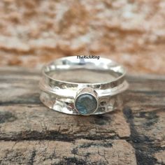 Welcome to my shop Handcrafted Round Labradorite Spinner Ring in Sterling Silver - Hammered Texture, Unique Meditation Jewelry, Stress Relief Accessory. Classic thick wide-band spinner silver ring Made of solid sterling silver. Fits men and women Perfect as a gift for a loved one. ❥ Metal: Solid 925 sterling silver ❥ US Ring Size: Choose Size This is a wide ring. We recommend choosing a half or a full size up than your regular size for best fit. ✈ Free Shipping (USPS) 🎁 Free Gift Box Thanks for Silver Fits, Wide Rings, Spinner Ring, Spinner Rings, Hammered Silver, Wide Bands, Sterling Silber, Solid 925 Sterling Silver, Labradorite