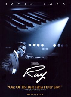 a man standing in front of a piano with the words ray on it