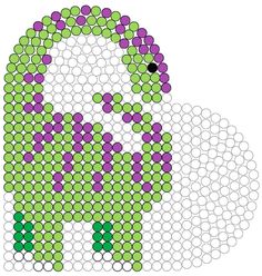 a green and purple dotty cat sitting on top of a white surface with circles around it