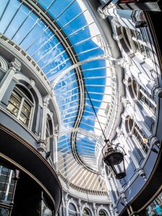 the inside of a building with many windows and skylights on it's ceiling