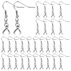 several pairs of dangling earrings with chains attached to each earring, all in different shapes and sizes