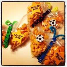 some snacks are wrapped in plastic bags with soccer stickers on them, and one has a star