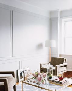 a living room filled with furniture and a coffee table