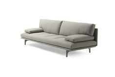 a gray couch with pillows on top of it