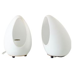 two white speakers sitting on top of each other