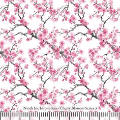 a white background with pink flowers and branches on the left side of the image is a ruler