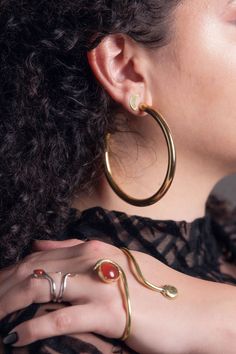 Part of our Sacred Serpent collection One size, adjustable Made of Brass Made with Carnelian Easy to wear, simply slip over palm and squeeze to adjust We are so excited to finally have the Diosa Serpiente Palm Cuff on the site. Diosa Serpiente is snake goddess in Spanish, a constant source of inspiration for us, the power of shedding of what no longer serves us, and evolving is something we endorse 100%. Palm cuffs are easy to wear, simply slip over palm and adjust the size. Pair this up with ou Palm Cuff, Snake Goddess, The Phases Of The Moon, Multiple Piercings, Phases Of The Moon, Moon Studs, Beautiful Moon, Hand Jewelry, In Spanish