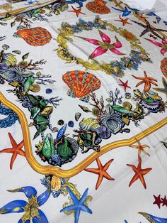 an image of a table cloth with sea creatures and starfishs on white background