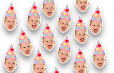 a group of baby faces with party hats on