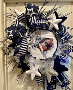 a football wreath is hanging on the front door for someone's birthday or other special event