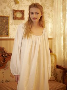 Immerse yourself in the embrace of 100% cotton with this Victorian-inspired women's nightgown. Revel in the soft, cloud-like comfort and feel stunning in its roomy design. The well-constructed garment features clean lines, creating a breathable and anti-static experience. Long sleeves with elastic cuffs are used to tolerate all body types. Embrace the cooling comfort of the elastic square neck design and enjoy the lovely, yet modest, outfit that allows unrestricted movement. This nightgown, reminiscent of the royal court style of the Victorian Edwardian era, transcends being just a garment; it's the essence of dreams. Washed in the highest quality cotton, it remains cool and feminine, providing a regal experience that makes you feel like a Victorian Princess. Its authenticity shines throug Medieval Nightgown, Edwardian Nightgown, Nightgown Cotton, Linen Nightgown, Nightgown Long, Victorian Nightgown, White Nightgown, Modest Outfit, Square Neck Long Sleeve