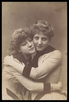 an old photo of two women hugging each other