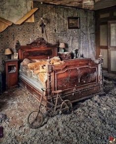 an old fashioned bedroom with a bicycle parked in front of the bed