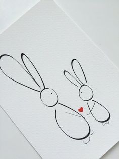 an image of two rabbits with hearts in their eyes on a white paper background that says love