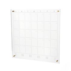 a white wall calendar with gold numbers on it