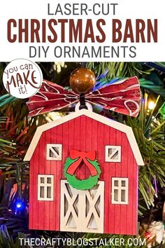 a red barn ornament hanging from a christmas tree with text overlay that says laser cut christmas barn diy ornaments