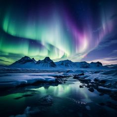 an aurora bore is seen above the snow covered mountains in this beautiful photo, with bright green and purple lights