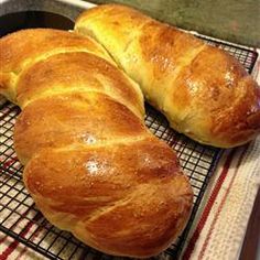 two croissants sitting on top of a cooling rack