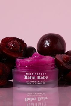 Indulge in the sweet and nourishing Balm Babe Black Cherry Lip Balm. Made with shea, cocoa, and avocado butters, and coconut oil, this natural and vegan lip balm will leave your lips smooth and hydrated. Pucker up and add the cherry on top to your lip care routine. Made in the USA Ingredients: Agave Tequiliana (Agave Nectar), Daucus Carota (Vitamin E) Carrot Powder, Citrus Sinensis (Vitamin C) Orange Peel Powder, Prunus Amygdalus Dulcis (Sweet Almond) Oil, Ricinum Communis (Castor) Seed Oil, Cet Natural Lip Scrub, Cherry Lip Balm, Scented Lip Balm, Avocado Butter, Lip Care Routine, Daucus Carota, Cherry Lips, Vegan Lip Balm, Sugar Lip Scrub