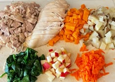 chopped vegetables and meat on a cutting board