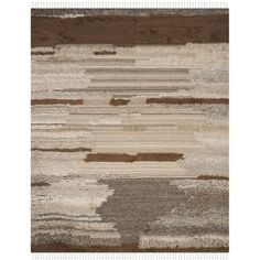 an area rug with different colors and patterns on the floor, including brown, beige, gray