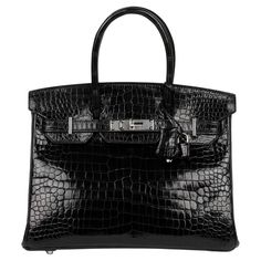 Hermès Black Shiny Porosus Crocodile Leather Birkin 30cm Retourne Brand- Hermès Model- Birkin 30cm Product Type- Tote Serial Number- * Age- Circa 2016 Accompanied By- Hermès Dust Bag, Lock, Keys, Clochette, Spa Receipt Colour- Black Hardware- Palladium Material(s)- Porosus Crocodile Leather Height- 25cm Width- 30cm Depth- 16cm Handle Drop- 10cm Interior- Black Leather Closure- Turn Lock, Padlock Country of Origin- France CITES/Export Restrictions- Please note, this item may be subject to CITES r