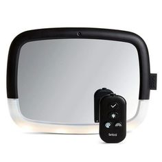 an image of a side view mirror with the light on and remote control attached to it