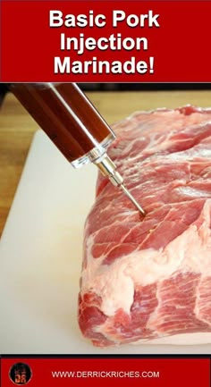 a piece of raw meat being cut into pieces