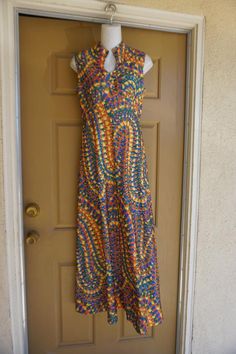 Vintage 1970s maxi dress.  No tags fits like a Large. In good vintage condition. no stains, holes, or tears. Please see measurements.Measurements taken across front lying flat 19" across front armpit to armpit14" across front of empire waist17" across natural waist55" length 1970s Style Multicolor Maxi Dress, Vintage Multicolor Sleeveless Maxi Dress, Multicolor Sleeveless Vintage Maxi Dress, 70s Inspired Fitted Maxi Dress, Multicolor Vintage Print Maxi Dress, Multicolor Maxi Dress, 70s Maxi Dress, Silk Nightgown, Dirndl Dress