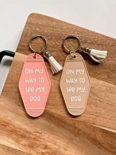 two key chains that say on my way to see my dog