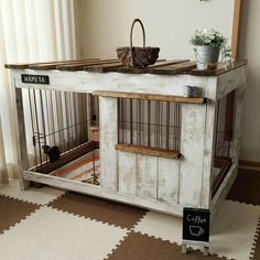 a dog kennel with a basket on top of it