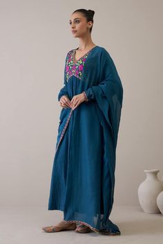 Indigo blue pure silk chanderi anarkali with floral and resham hand embroidery. Comes with churidar and a pure cotton mulmul dupatta. - Aza Fashions Blue Dabka Kaftan Maxi Length, Blue Maxi Kaftan With Dabka Detail, Blue Maxi Length Kaftan With Dabka, Traditional Blue Georgette Kurta, Blue Kurta With Dabka Work For Navratri, Blue Slub Silk Kurta For Festivals, Blue Mulmul Traditional Wear For Eid, Traditional Blue Chanderi Churidar, Blue Churidar With Cutdana In Traditional Drape