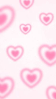 many pink hearts are arranged in the shape of heart shapes on a white wallpaper