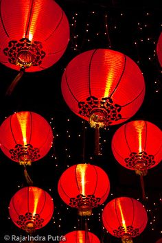 many red lanterns lit up in the dark