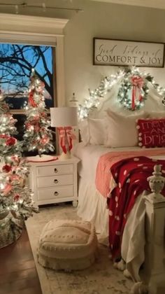 a bedroom decorated for christmas with white and red decor