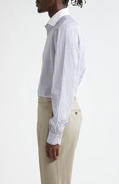 Breathable cotton offers lasting comfort in this classic striped button-up shirt grounded in the Neapolitan label's storied Italian tailoring. Each shirt takes a single craftsperson more than two hours to make—from careful fabric selection to hand-sewing the collar and button holes. Front button closure Spread collar Long sleeves with button cuffs 100% cotton Dry clean Made in Italy Designer Clothing Italian Tailoring, Button Holes, White Blue, Hand Sewing, Button Up Shirts, Designer Clothing, Button Up, Dry Clean, Take That