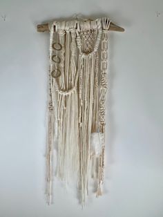 a wall hanging made out of wood sticks