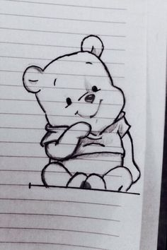 a drawing of a teddy bear sitting on top of a piece of paper