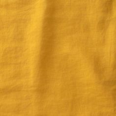 an image of a yellow cloth textured with some sort of fabric that looks like linen