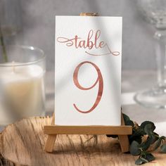 a table number is displayed on a wooden stand