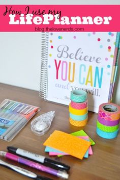 a desk with pens, markers, and paper on it that says how i use my life planner