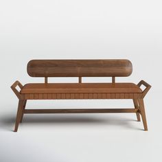 a wooden bench sitting on top of a white floor