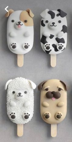 four popsicles shaped like dogs and sheeps on top of each other in different shapes