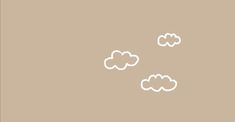 three white clouds floating in the air on a brown background with space for your text