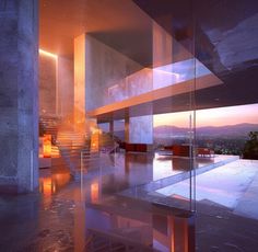 the interior of a modern house with glass walls and stairs leading up to it's second floor