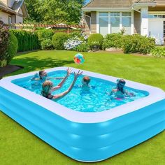 an inflatable swimming pool with kids playing in it