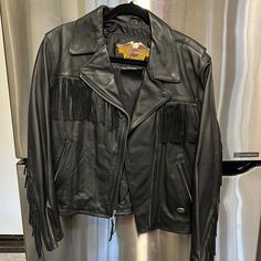 Black Harley Davidson Brand, Heavy Leather, Zippered And Fringed Jacket, Lots Of Detail, Back Waist Elastic Synched, Excellent Condition, Size Large Leather Fringe Jacket, Fringed Jacket, Black Harley Davidson, Harley Davidson Jacket, Fringe Leather Jacket, Fringe Jacket, Leather Fringe, Leather Jackets, Harley Davidson