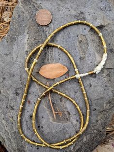 A beautiful strand of 100 Old Brass Spacer Beads from Ethiopia on cord 27 inches long. Each metal bead measures approximately 4mm x 6mm. The hole is 2mm. African Brass Beads, Prescott Az, Metal Bead, Metal Beads, Ethiopia, Spacer Beads, Brass, Beads, Electronic Products