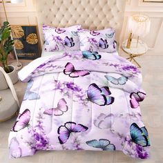 a bed with purple butterflies on it