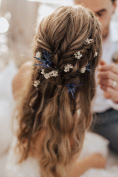 long brown hair, loosely braided with some dried flowers Braided Half Up Half Down Hair With Flowers, Wedding Hair With Dried Flowers, Wedding Hair Half Up Half Down Flowers, Nature Inspired Hairstyles, Boho Flower Hair Piece, Wild Flower Wedding Hair, Wedding Braid With Flowers, Dried Flower Wedding Hair, Half Up Half Down Hair Flowers